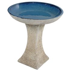 a white and blue bowl sitting on top of a table