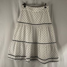 This Polka Dot And Lightweight Midi Skirt From Ann Taylor Is Both Comfortable And Fashionable For Any Occasion! It Is In New Without Tags Condition With No Holes, Rips, Stains, Or Alterations. Measurements Are Shown In The Pictures. Features: - 100% Polyester Skirt Liner - Black Ribbon Detailing - Back Zipper Size: 00 Petite Condition: New Without Tags Polka Dot Midi Skirt, Polyester Skirt, Taylor White, Black Ribbon, Women Skirts Midi, White Polka Dot, Ann Taylor, Midi Skirt, Polka Dot