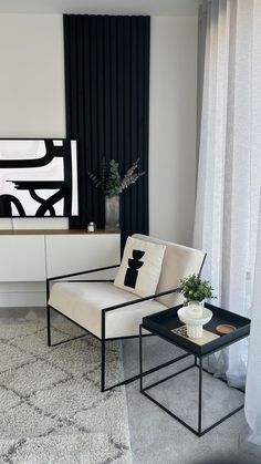 a living room with black and white decor