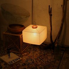 a lamp sitting on top of a wooden table