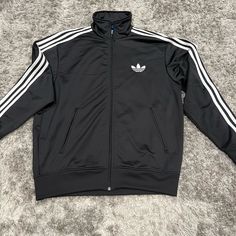 Adidas Originals Black Firebird Tracksuit Top Jacket Men’s Size: Large I Believe Brand New Without Tags! Never Worn Adidas Long Sleeve Outerwear With Three Stripes, Adidas Long Sleeve Track Jacket With Three Stripes, Adidas Long Sleeve Track Jacket With Pockets, Fall Adidas Branded Streetwear Outerwear, Winter Windbreaker With Three Stripes And Long Sleeves, Fitted Outerwear With Three Stripes For Streetwear, Fall Three Stripes Outerwear For Streetwear, Winter Long Sleeve Windbreaker With Three Stripes, Adidas Winter Outerwear With Three Stripes Branding