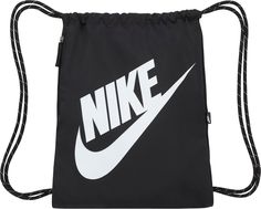 Grab your gear and go with the Nike Heritage Gym Sack. Lightweight and simple, it's an easy way to store and carry the gear you need to train, play and make the most of your day. This product is made with at least 65% recycled polyester. Fit & Design: Spacious main compartment provides ample storage A larger Futura print and woven flag label update the look Drawcord closure for easy access to the main compartment Zipper side pocket secures small items like a phone Polyester fabric is durable and Nike Sports Bag, Mochila Jansport, Mochila Nike, Gym Sack, Sport Nike, Nike Bags, Nike Swoosh Logo, String Bag, Nike Sports