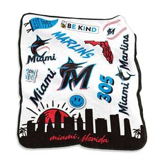 the miami marlins throw blanket has many different logos on it and is white with black trim