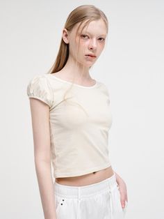 This is a trendy and feminine top by ETMON that is made out of high quality and sturdy material. With distinctive mood of the design and modern feminine look, you can style it for your casual daily outfit.- Wide round neckline and slim silhouette- Strap with hole slits on the back- Feminine and trendy look Chic Fitted T-shirt For Day Out, Fitted Cream T-shirt With Crew Neck, Trendy Cream Summer T-shirt, Chic Fitted Crop Top T-shirt, Relaxed Fit Feminine Crew Neck Top, Chic Crew Neck Top For Day Out, Feminine Crew Neck Top For Spring, Fitted Crew Neck Top For Day Out, Trendy Fitted Solid Color Blouse