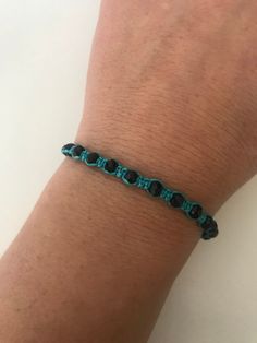 "SPECIAL OFFER!! Buy TWO get ONE for FREE!! of equal or lesser value (please, don't add your free product to your shopping cart or you will be charged for it. Pick 1 product and leave the full name of it in the \"Note to enjoywelrydesign\" Box during checkout.) This is a turquoise macrame bracelet with black crystal beads. Protect yourself from selfishness and negativity with this Kabbalah bracelet. The simplicity of this bracelet make it easy to match. And also very elegant. The bracelet is adj Black Beaded Friendship Jewelry, Black Beads Jewelry For Friendship, Adjustable Black Beaded Friendship Bracelets, Casual Beaded Bracelets With Black Beads As Gift, Casual Black Round Beads Friendship Bracelets, Casual Black Friendship Bracelets With Round Beads, Adjustable Casual Crystal Bracelet, Spiritual Black Braided Bracelets For Friendship, Casual Black Friendship Bracelet With Black Beads