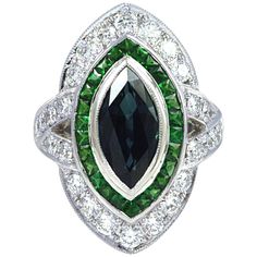 This Art deco inspired ring is centered with a bezel-set marquise shaped blue Sapphire, surrounded by Tsavorites 0.92 carat and round brilliant-cut Diamond 1.24 carats set in 18 karat White Gold. The ring is currently a size 52 (6 1/4 US) , with easy adjustment up or down. Width: 2.0 cm Length: 2.6 cm Ring Size: 52 "We first opened doors in 1980 when it was then situated in the vicinity of the Victory Monument; a small and modest storefront with a couple of counters. From its humble beginnings t Radiant Diamond Rings, Round Diamond Ring, Blue Sapphire Diamond, Diamond Ring Settings, Radiant Diamond, Half Eternity Ring, Diamond Star, Star Jewelry, Pretty Rings