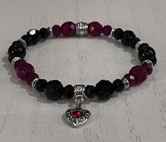 "Beautiful Czech ruby red and jet black glass beads, black and red luster beads and antique silver spacers are paired with a tiny silver heart charm with a rhinestone embellishment to create a fun to wear wrist mala for Valentines or anytime a little extra heart felt Goth vibe is needed. The bracelet is strung on 1mm Stretch Magic cord and easily rolls over your hand to rest on the wrist. I can custom make any size you need. Just select the size you need from the pull down menu or convo me with Dark Beaded Bracelets, Beaded Bracelets String, Goth Bead Bracelet, Goth Bracelets Diy, Black Beaded Bracelets With Heart Beads For Jewelry Making, Black Bracelet Aesthetic, Red And Black Bracelets, Vampire Bracelet, Grunge Bracelets