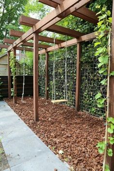 an outdoor garden area with wood and wire