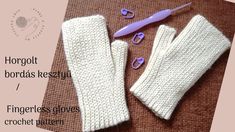 two white knitted mittens and one purple pair of scissors