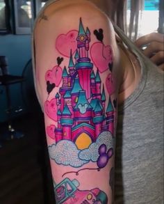 a woman with a castle tattoo on her arm