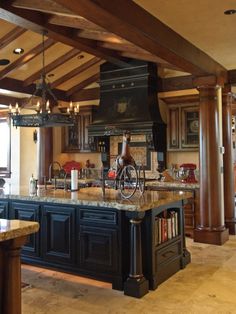 a large kitchen with an island in the middle