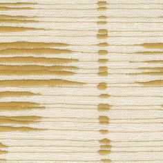 a close up view of the textured fabric with yellow and white stripes on it