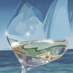 a close up of a wine glass with water in the bottom and blue sky behind it