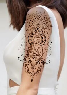 a woman's arm with a tattoo on it and an image of a buddha