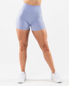 HIGHLIGHTS. High-waisted short 3-tiered tapered waistband. Seamless, knit fabric. No front seam. Back scrunch seam detail to enhance curves. Leg and glute contouring panels. ForeverKnit core logo on waistband 4.5" inseam FIT SUGGESTION. This item runs true to Alphalete’s standard seamless fit.. If you are between sizes, we recommend sizing up.. Model is 5’4”/162.5cm, wearing a size XS with a 26”/66cm waist and 39.5”/100.3cm hips. MATERIALS AND WASHING DIRECTIONS. 51% Polyamide, 38% Polyester, 11 Blue Bottoms With Seamless Construction For Training, Blue Seamless Bottoms For Training, Blue Workout Shorts With Wide Waistband, Seamless Fitted Athletic Shorts, Functional Blue Bottoms With Seamless Construction, Fitted Blue Shorts With Contoured Waistband, Fitted Training Shorts With Wide Waistband, Blue Fitted Shorts With Contoured Waistband, Blue Athleisure Shorts With Contoured Waistband