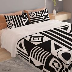 a bed with black and white designs on it