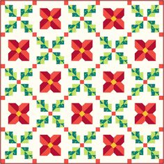 a quilt with red, green and yellow flowers on it's sides is shown