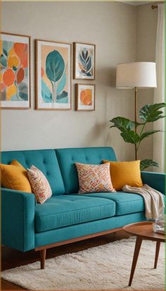 a living room with blue couches and paintings on the wall above them, along with a coffee table