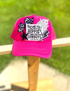 Hot pink on hot pink trucker hat with "Raising Hell with the hippies and the cowboys" patch designs. These are made to order in house please allow a max of 10-14 business days. Product may be ready sooner depending on current demand. Thank you so much! Fun Pink Hat For Music Festival, Trendy Pink Hats For Music Festival, Fun Pink Hats For Country Events, Fun Pink Hat For Country Events, Pink Western Cap Hat, Western Style Pink Cap, Pink Western Style Cap, Pink Trucker Hat With Curved Brim For Festivals, Pink Hat For Rodeo, One Size Fits Most