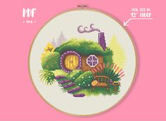 a cross stitch pattern with a small house in the woods on it's side