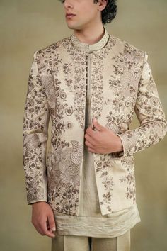 Sand Grey Short Jacket | Jatin Malik – B Anu Designs Elegant Long Sleeve Nehru Jacket For Designer Wear, Reception Bandhgala With Floral Embroidery And Long Sleeves, Floral Embroidered Long Sleeve Nehru Jacket For Reception, Elegant Bandhgala With Floral Embroidery And Traditional Drape, Elegant Unstitched Long Sleeve Nehru Jacket, Designer Fitted Beige Nehru Jacket, Elegant Bandhgala With Floral Embroidery For Reception, Designer Long-sleeve Embroidered Nehru Jacket, Designer Beige Fitted Nehru Jacket