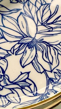 a blue and white plate with flowers on it