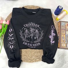 The Thirteen Embroidered Sweatshirt, Throne of Glass Embroidered Sweatshirt, Bookish Gift, Throne of Glass Embroidered, Reader, Acotar Shirt Stay cozy and stylish with our embroidered sweatshirts. Crafted with comfort in mind, these sweatshirts are made from soft and durable materials that are perfect for those chilly days. What sets them apart is the exquisite embroidery detail, which adds a personalized touch to your everyday wear. Choose from a variety of designs and customize your sweatshirt Throne Of Glass Dust Jacket, Throne Of Glass Merch, Throne Of Glass Sweatshirt, Acotar Apparel, Acotar Shirt, The Thirteen, Shirt Stays, Embroidered Sweatshirt, Sweat Shirts