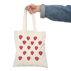 This is a cute one side printed strawberry tote bag. With a wide range of captivating prints and patterns to choose from, you can find the perfect bag to complement your style, whether you're heading to the beach, the market, or a night out with friends. Casual Canvas Gift Bag, Cute Reusable Tote Bag, Casual Reusable Bags For Gifts, Rectangular Bags With Strawberry Print As Gift, Rectangular Strawberry Print Bag As A Gift, Trendy Red Canvas Gift Bag, Rectangular Bags With Strawberry Print For Gifts, Rectangular Bag With Strawberry Print As Gift, Red Bag With Strawberry Print As Gift