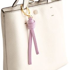 Add a touch of flair to your bag or backpack with our Every Day Bag Charm. Designed to elevate your accessory game, this stylish charm features a stylized tassel that adds a playful and sophisticated touch to any bag, making it the perfect accessory to express your unique sense of style. Vera Bradley Every Day Bag Charm Keychain in Purple Elegant Everyday Bag Charm With Logo, Elegant Bag Charm With Logo, Elegant Rectangular Bag Charm, Elegant Everyday Bag Charm, Everyday Bag Charm With Lobster Clasp, Elegant Bag Charm For Everyday Use, Trendy Bag Charm Keychain Fashion Accessory, Logo Charm Bag For Everyday Use, Trendy Bag Charm As A Gift