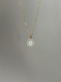 One of my personal favorites, this opal necklace is a must-have! Information: ✨ Simulated Opal Gemstone | High Quality ✨ Sterling Silver (925 stamped) | 14K Gold Plated ✨ AAA Cubic Zirconia diamonds ✨ Adjustable length: 16" - 18" ✨ Hypoallergenic  ✨ Tarnish resistant A classic, this necklace is the perfect addition to you collection - it holds a beautiful sophisticated vibe that upgrades your outfit instantly. Personally, I wear this piece quite often and the sparkles are so strong that I am alw Formal Opal Round Necklace, Formal Round Opal Necklace, Delicate Opal Gemstone Necklaces, Opal Round Pendant Necklace For Anniversary, Dainty Opal Pendant Necklace, Dainty Round Opal Necklace, Oval Opal Necklace For Anniversary, Anniversary Opal Round Pendant Necklace, Anniversary Opal Necklace With Round Pendant