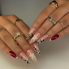 Alternate nails with a cheetah, star, and red nail art. Nails Inspiration Leopard Print, Vegas Nails Ideas Sparkle Almond, Animal French Tip Nails, Exotic French Tip Nails, Chrome Leopard Nails, How To Do Leopard Print Nails, Nails Design Leopard, Nail Art Designs Leopard, Nail Ideas Leopard Print