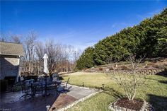 an outdoor patio with table and chairs