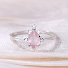 0.8Carat Pear Cut Rose Quartz Engagement Ring In Solid Rose Gold | BBBGEM Silver Rose Quartz Engagement Ring, Rose Quartz And Diamond Engagement Ring, Kawaii Engagement Ring, Rose Quarts Ring, Rose Quartz Engagement Ring Silver, Elegant Pink Diamond Ring For Weddings, Elegant Pink Diamond Wedding Ring, Exquisite Pink Diamond Wedding Ring, Wedding Pink Diamond Cut Ring