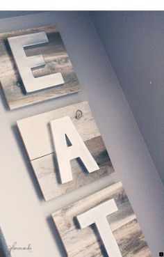 two wooden letters that are hanging on the wall