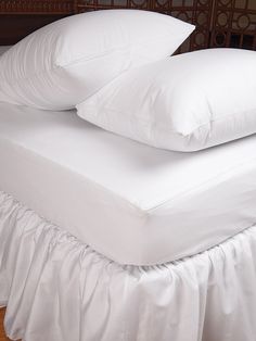 two white pillows stacked on top of each other