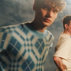 two young men standing next to each other