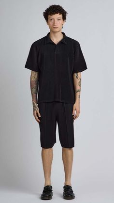 One size. fits xs-l  color: black  pleated material  quarter button up  short sleeve  100% polyester  dry clean only  by the nkc store    product measurements  chest: 132cm / 52in  length: 66.04cm / 26in    model is 185cm / 6'1" wearing size o/s Black Cotton Short Sleeve Shirt For Streetwear, Techwear Short Sleeve Cotton Shirt, Black Ring-spun Cotton Streetwear Shirt, Black Organic Cotton T-shirt For Streetwear, Black Organic Cotton Streetwear T-shirt, Pleated Shirt, Caged Sandals, Black Tank Dress, Sale Store