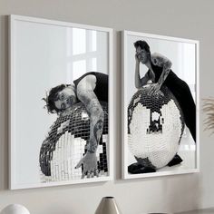 two framed photographs of women on mirrors in a living room, one with her legs spread out and the other with her head down