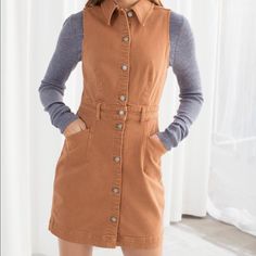 Adorable & Other Stories Mini Dress! Structured Denim Makes Up This High Quality Button Up Dress, Complete With A Collar, Pockets (!), And A Nipped In Waist. So Cute As A Transition Piece For Any Season! Bust: 14.5” Across, Waist 12.5”, Waist To Hem 18” Size 2, 99% Cotton 1% Elastane. Tan Mini Dress, 70s Look, Denim Mini Dress, Button Up Dress, Fashion Story, Sleeveless Mini Dress, Denim Mini, Color Orange, Stretch Cotton