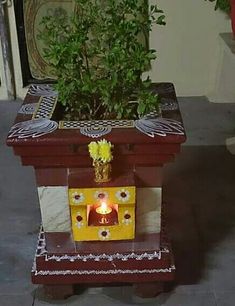 a potted plant sitting on top of a wooden stand