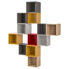 a multicolored shelf unit with four different shelves on each side and one red box in the middle