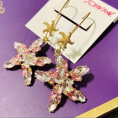 Gorgeous Nwt Betsey Johnson Starfish Statement Drop Hook Earrings: - Fun And Glamorous Starfish Design - Gold Tone Plated Metal. - Sparkly Shades Of Pink Crystals. - Limited Edition Piece! Makes You Stand Out From The Crowd! - Length Is Approx. 2.75”, Width Is Approx. 1.25”. - Brand New Condition With Tags. Thanks For Stopping By! Check Out My Closet To Find More Treasures (Including More Betsey!) And Bundle For A Discount Tags: Betsy Betseyville Designer Jewelry Costume Accessories Fruit Juicy Pink Starfish Jewelry For Gift, Pink Starfish Charm Jewelry, Starfish Charm Jewelry For Parties, Pink Star Jewelry With Starfish Charm, Pink Star-shaped Jewelry With Starfish Charm, Party Jewelry Starfish Charm, Pink Star-shaped Jewelry For Party, Elegant Star-shaped Earrings For Summer, Pink Star Earrings For Party