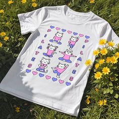 Add some cuteness to your workout wardrobe with our Pilates Cat Shirt and Sweatshirt featuring an adorable cats doing pilates! ⭐Unisex Sweatshirt⭐ *50% cotton, 50% polyester *Medium-heavy fabric *Regular fit for a comfortable feel *Tear-away label  *Size up for trendy oversized look  ⭐Unisex Short Sleeve T-Shirt⭐ * Lightweight fabric *Runs true to size *Tear-away label *Size up for trendy oversized look  *Perfect for active and leisure wear *Made with 100% Airlume combed and ring-spun cotton ⭐Ca Playful Stretch Crew Neck Top, Playful White Stretch Top, Casual Short Sleeve Tops For Pilates, Playful Sports Tops With Letter Print, White Cartoon Print Sports Top, White Cartoon Print Tops For Sports, Playful Cat Design Crew Neck T-shirt, Playful Crew Neck Sports Top, Playful Crew Neck T-shirt With Cat Design