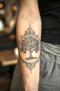 a person with a tree tattoo on their arm