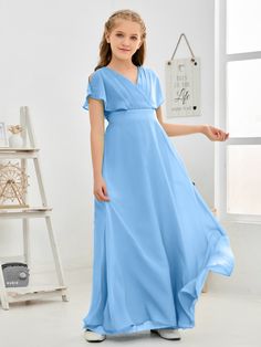 This Wavy V-neck Chiffon Junior Bridesmaid Dress is perfect for any special occasion. Constructed from a lightweight chiffon fabric, this dress features a wavy V-neckline for a elegant and sophisticated look. The long-flowing silhouette enhances the dress' graceful appearance. Perfect for junior bridesmaids, this dress is sure to make a lasting impression. Solid V-neck Chiffon Dress, Blue Chiffon V-neck Bridesmaid Dress, Solid Chiffon V-neck Dress, Flowy Solid Chiffon V-neck Dress, Flowy Solid Chiffon Dress With V-neck, Solid Color Flowy V-neck Chiffon Dress, Chiffon Bridesmaid Dress With Short Sleeves, Chiffon Wedding Dress With Surplice Neckline, Solid Chiffon Bridesmaid Dress