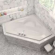 a bathroom with a large white bathtub next to a window