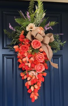 a bouquet of flowers is hanging on the front door with an advertise that reads,