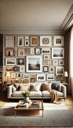 a living room filled with lots of framed pictures on the wall above a couch and coffee table