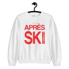 This aesthetic and cute design is exactly what you've been looking for winter sports vacation. It is a great gift for men, women, kids and for her or him. All our designs are original and unique that stand out in apres all day ski style. This soft sweatshirt has a loose fit for a comfortable feel. With durable print, it will be a walking billboard for years to come. .: Loose fit .: 50% Cotton; 50% Polyester (fibre content may vary for different colors) .: Medium fabric (8.0 oz/yd² (271.25 g/m²)) Winter White Screen Print Tops, Winter White Tops With Screen Print, White Screen Print Tops For Winter, Trendy Winter T-shirt With Logo Print, White Winter T-shirt With Logo Print, Winter Relaxed Fit T-shirt With Logo Print, Winter Sporty Comfortable Fit Top, Sporty Comfort Fit Winter Tops, Winter Long Sleeve T-shirt For Outdoor Activities