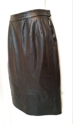 "Black lambskin Leather Skirt, fully lined. Brand:  CEZANNE Size:   6 Waist:  13 1/2\" side to side Hips:    17\" side to side Color:   Black Waist Band:  1 1/2\" Length:    24\"   Measurements were taken from under the waistband to hemline  Kick Pleat:  7\" Material:   100%   Lambskin Leather Lining:   50% Acetate, 50% Nylon Made in: China Condition:  Excellent Measurements were taken with garment laying flat.   Please check all measurements, as sizes vary from manufacturer to manufacturer, the Formal Knee-length Leather Skirt, Formal Leather Pencil Skirt, Black Leather Skirt For Evening, Formal Fitted Leather Skirt, Kick Pleat, Lambskin Leather, Waist Band, Leather Skirt, Womens Skirt